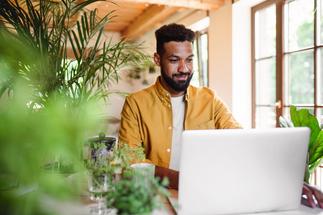 A man works from home at his laptop