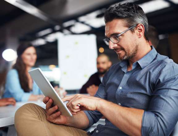 Man At Seminar With iPad